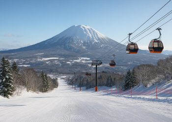 Snow-covered ski slopes with mountain views in Niseko and Yuzawa, Japan, winter sports destinations