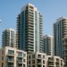 Modern high-rise condominium exterior highlighting quality building features and amenities