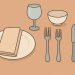 Elegant table setting displaying proper mealtime etiquette with neatly arranged dishes and utensils.